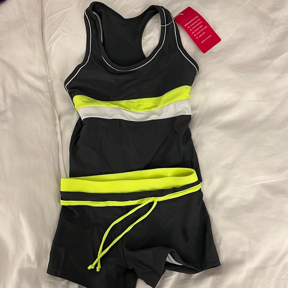 Two piece swim tank and shorts.